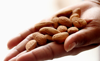 a bunch of almonds in a women  hand