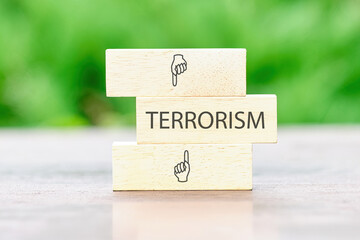 TERRORISM Back to school the inscription on wooden bars against a background of green plants is out...