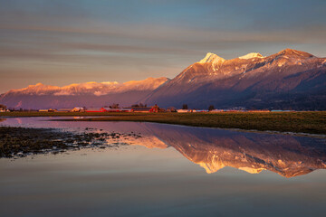 Snowy mountain peak reflection at sunset in Chilliwack, BC