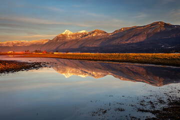 Reflection of the Cheam Mountain range in the farmlands of Chilliwack, Fraser Valley, BC