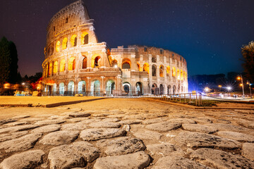 Rome, Italy. Colosseum Also Known As Flavian Amphitheatre In Night. Calmness Night Time. Bright...