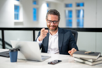 Naklejka premium Middle aged businessman working with laptop in office. Hispanic business man using laptop. Millennial man using laptop at office workplace. Ceo manager office worker business people working at office.
