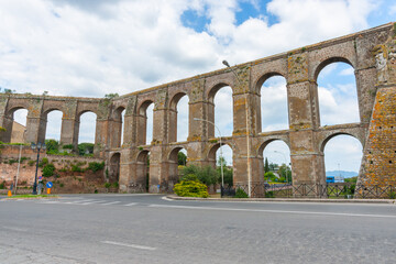 Fototapeta na wymiar Medieval stone walls and arches of Nepi aqueduct.