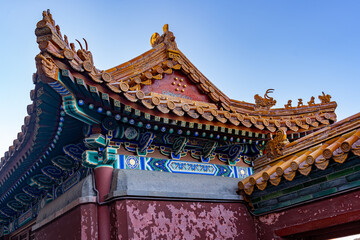 Beautiful Chinese architectural ornament adorning a roof at a historical traditional palace used by the Chinese Royal Families.