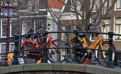 Colorful Bicycles Parked on a Bridge in Amsterdam, Netherlands