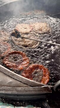 Chapli kabab is a popular street food in Pakistan and Afghanistan