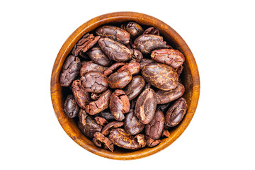 Top view of dry roasted cacao nibs in wooden bowl isolated on white background with clipping path.