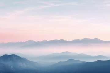 This photo showcases a mountain range shrouded in dense fog, creating a mysterious and atmospheric scene.