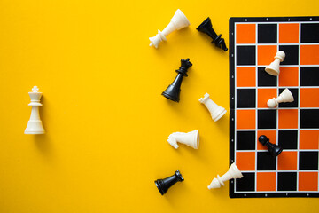 Top view chessboard on yellow background - Winner and Loser