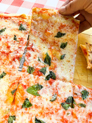 Close up view of pizza margherita italian traditional healthy carbo food nutrition at the restaurant pizzeria table. Eating italy pizzeria. food pizza picture. Health and lifestyle. Mediterranean life