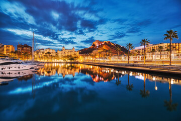 Illuminated Alicante Old Town Panorama at Dusk with Santa Barbara Castle and Harbor - obrazy, fototapety, plakaty