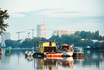 Boats and houseboats anchoring on rummelsburg lake in Berlin, Germany