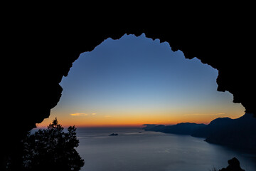 wonderful sunset from the Path of the Gods on the Amalfi Coast with a view of Capri and the Faraglioni and the Li Galli islet