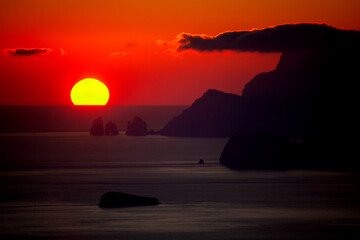 wonderful sunset from the Path of the Gods on the Amalfi Coast with a view of Capri and the...