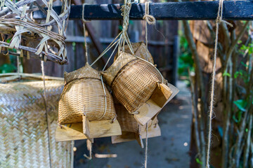The woven box for storing sticky rice in northern Thailand is called "Rice basket"