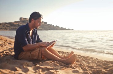 Man Beach With Tablet