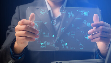 Cg collage businessman demonstrates a transparent tablet screen on which the symbols of the digital modern world are located
