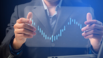 Footage for an economic or financial blog. On a transparent screen in the hands of a businessman, charts and digital indicators move over Chinese candlesticks. Cg