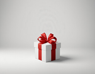 Fototapeta premium A classic white gift box adorned with a vibrant red ribbon, set against a soft grey backdrop, embodies timeless elegance and the joy of gifting. Generative AI.