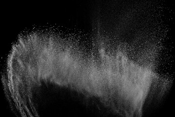 Abstract white dust on black background. Light smoke texture. Powder explosion. Splash water...
