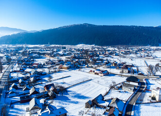 Fototapeta na wymiar Aerial view of Moldovita village in Suceava county - Romania in winter