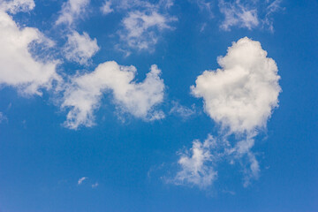 Landscape with blue sky and altocumulus white clouds beautiful blue sky background. Beauty clear cloudy in sunlight calm bright winter or summer windy air background.