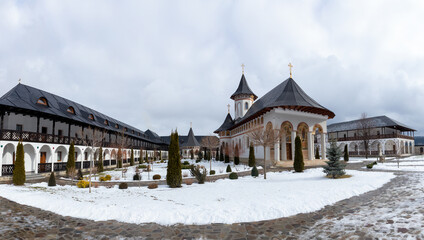 Fototapeta premium Nativity of the Mother of God monastery Marginea Suceava county - Romania in winter