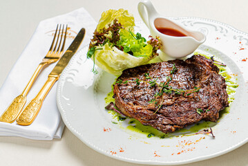steak with sauce and vegetables
