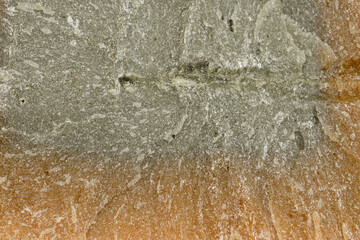 Struktura retro szarego mydła z bliska, przypominająca popękany stary beton 