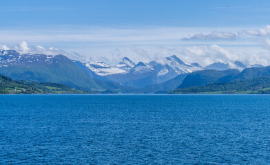 Fototapeta premium Romsdalsalpane or the Romsdal Alps a mountain range surrounding the Romsdalen valley in Møre og Romsdal county, Norway., Scandinavia, Europe