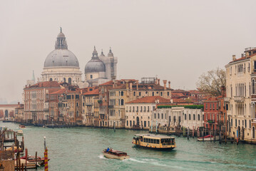 Fototapeta na wymiar Famous palaces of the local nobility, ancient bridges at the Grand Canal in Venice, Italy. Panorama