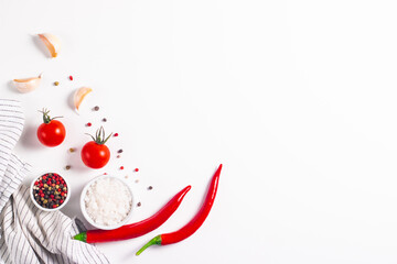 White cooking background with spices, vegetables and utensils. Top view. Free space for your text.