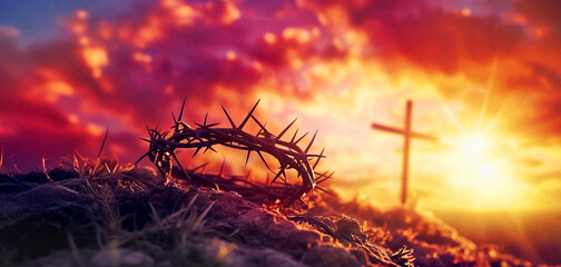 crown of thorns and cross at sunset, easter background - obrazy, fototapety, plakaty