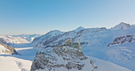 Panoramic landscape of Sphinx observatory and Aletsch glacier on Jungfraujoch Swiss Alps, Switzerland. Jungfrau top of europe in interlaken one of the highest mountain in the world on winter sunny day