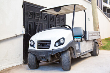 Old electric vehicle with a body for work on the hotel premises.