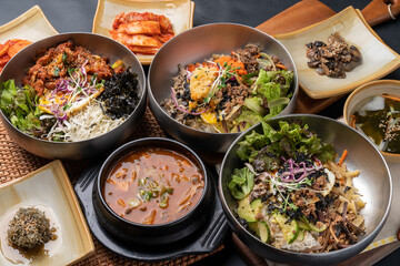 Korean food, soybean paste stew, spicy pork, bibimbap, side dishes, vegetables, kimchi, earthen pot,