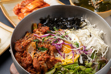 Korean food, soybean paste stew, spicy pork, bibimbap, side dishes, vegetables, kimchi, earthen pot,