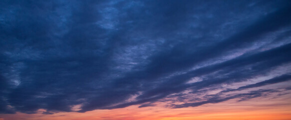 Sky at dawn with layered clouds. Abstract natural background.