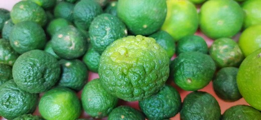 Many of green lemon. Different jeruk nipis and jeruk limau background.Sold in Indonesian local market