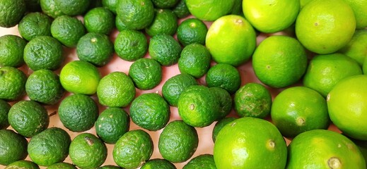Many of green lemon. Different jeruk nipis and jeruk limau background.Sold in Indonesian local market