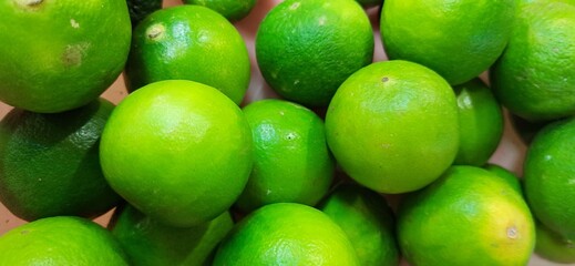 Many of green lemon. Different jeruk nipis and jeruk limau background.Sold in Indonesian local market