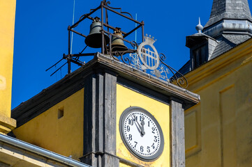 Ancient architecture of clock and bell tower in the city hall building, Segovia, Spain