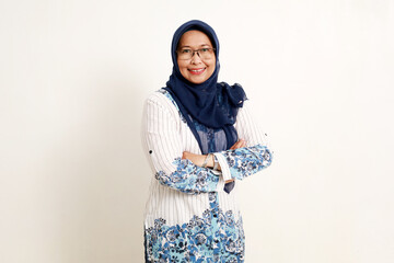 Asian elderly woman standing looking at the camera with folded hands