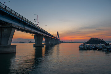 Bridge over the sea and scenery at dawn
