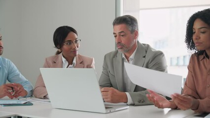 International diverse professional executives business team workers and board leaders group using laptop computer discussing corporate management working in office collaborating at group meeting. - Powered by Adobe