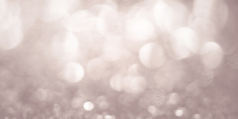 Bokeh background in pearl color. Beautiful festive glowing background. Banner