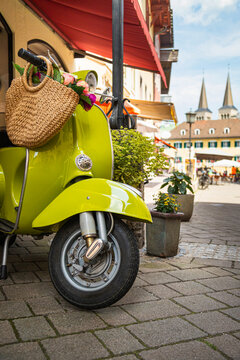 Scooter bike with basket of flowers in European old town