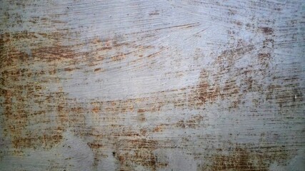 Grungy concrete wall texture with scratched paint.