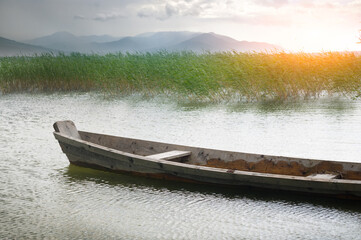 summer landscape. Wooden boat on the river.