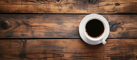 A Captivating Top View of Coffee Cup on a Wooden Table Background
